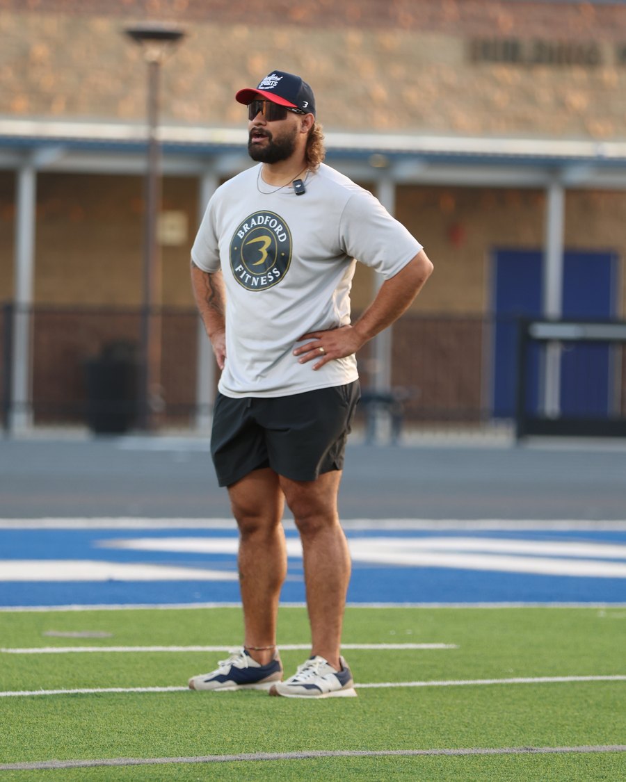 Carl Bradford, founder of Bradford Sports, on the field at golden hour